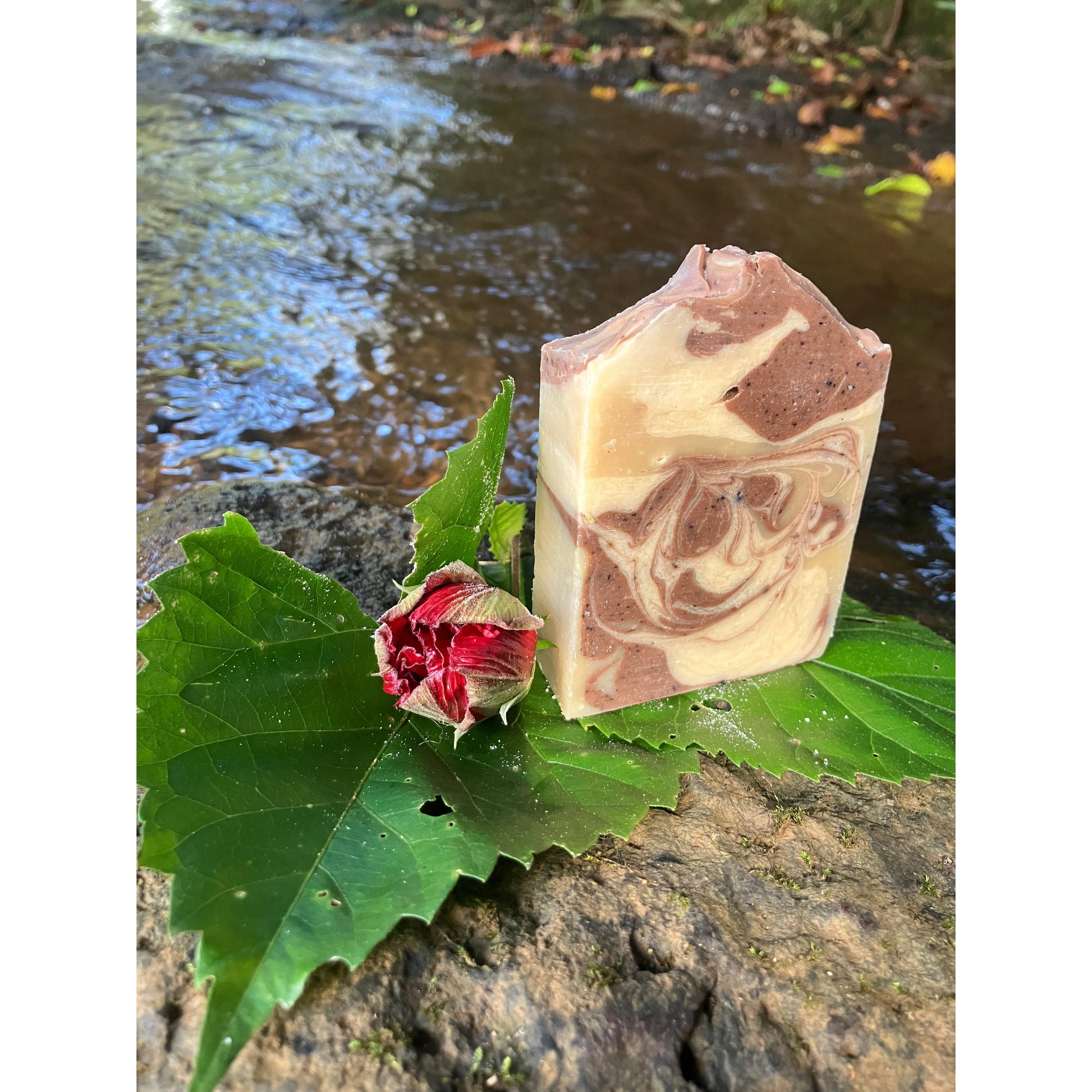 Marbled soap bar on a leaf with a natural background