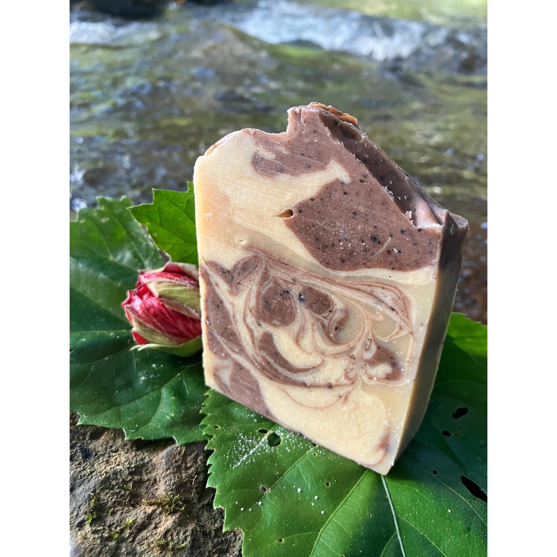 Swirled soap bar on a leaf with a natural background