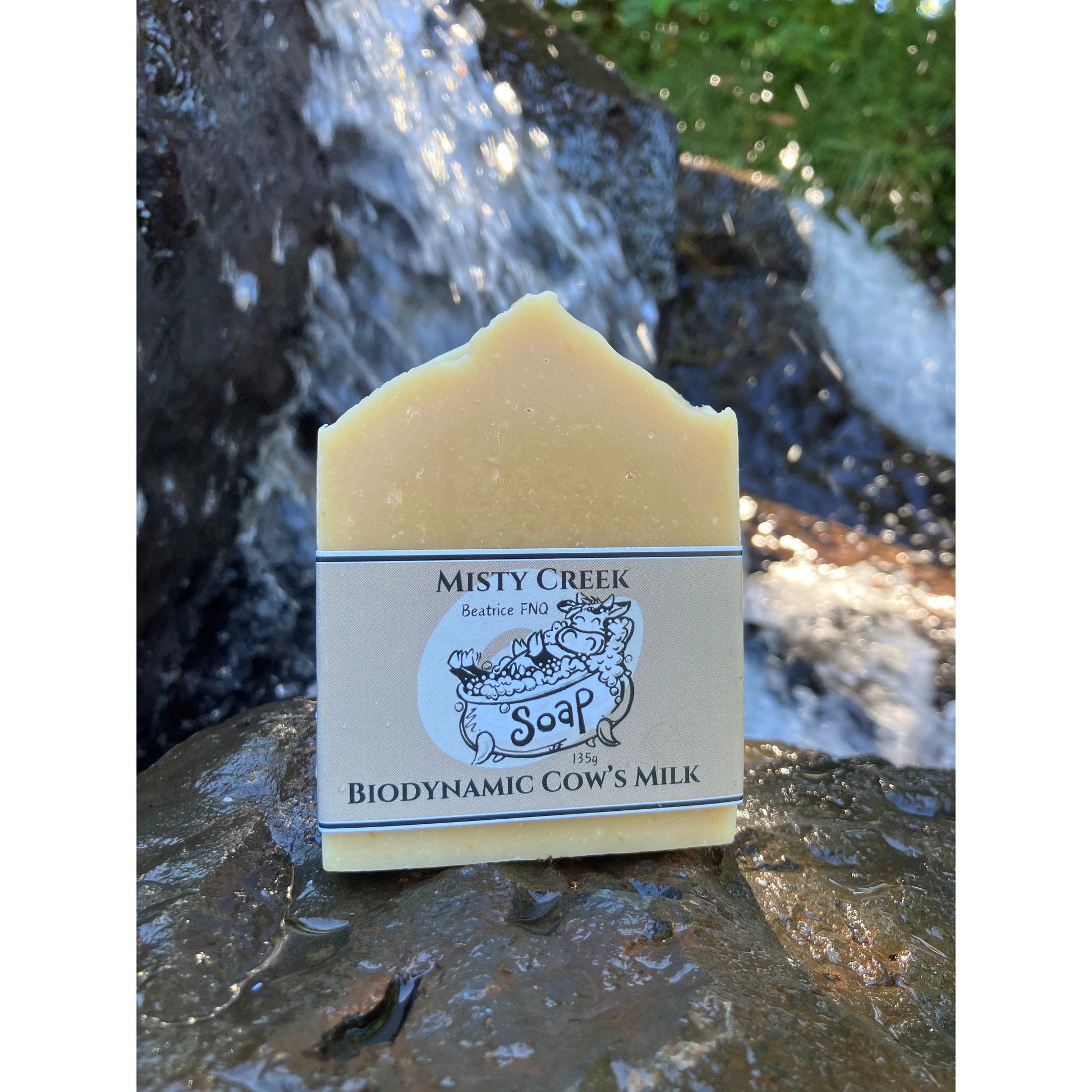 Bar of soap with 'Misty Creek Soap' label against a natural background